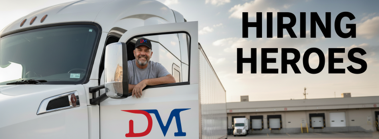 Delivery Matic CDL-A driver leaning from the cab of a white tractor-trailer at a distribution dock.